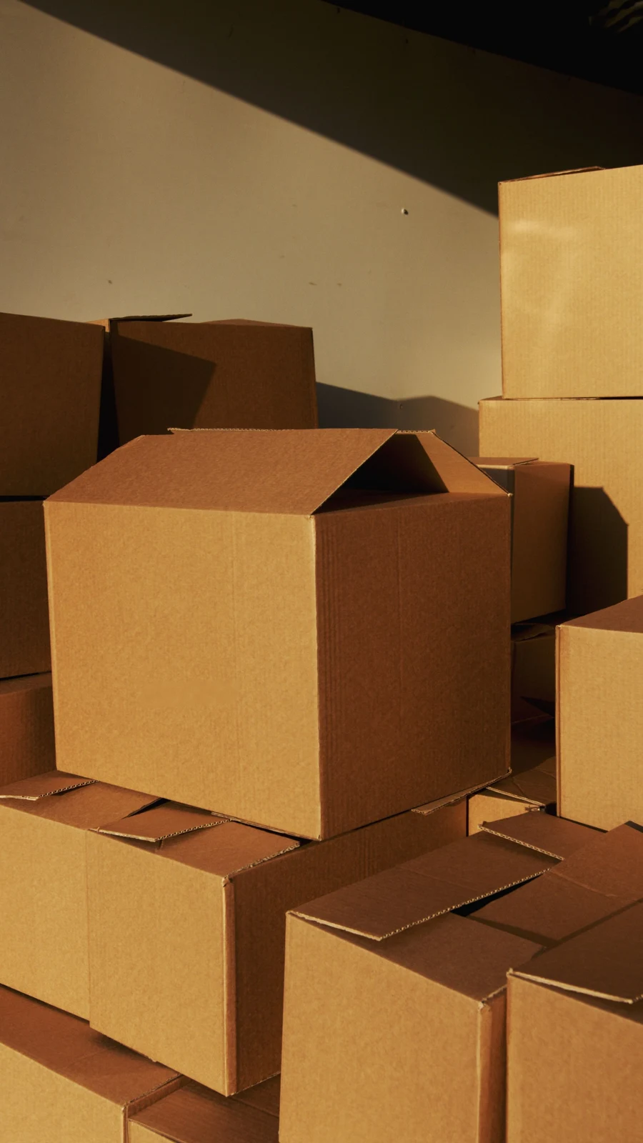 Plain cardboard packaging boxes — representative stock photograph